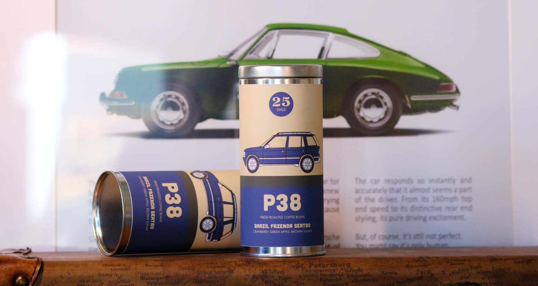 P38 Blend cans in front of a classic car
